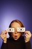 Surprised woman holding paper eyes to her face 2.jpg