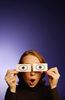 Surprised woman holding paper eyes to her face 3.jpg