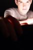 Teenaged boy with lit up face 1.jpg