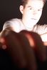 Teenaged boy with lit up face.jpg