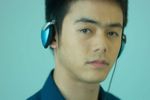 Thoughtful man listening to music on headphones 2.jpg