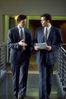 Two men in suits walking.jpg