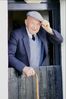 Well dressed elderly man with cane.jpg