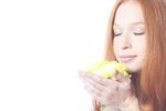 Woman holding flower uid 1343054.jpg