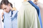 Woman holding up blue shirt.jpg