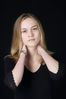 Woman in front of black background uid 1426768.jpg