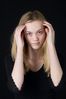 Woman in front of black background uid 1426774.jpg