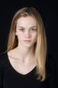 Woman in front of black background uid 1426776.jpg