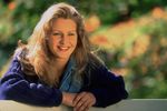 Woman leaning on fence.jpg