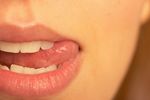 Woman licking corner of mouth.jpg