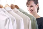 Woman looking through rack of shirts.jpg