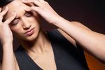 Woman massaging forehead uid 1426302.jpg