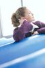 Woman sitting in blue vinyl seat uid 1283659.jpg