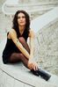 Woman sitting on stone railing an 1.jpg