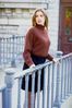 Woman wearing brown sweater.jpg