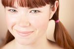 Woman with bare shoulders smiling.jpg