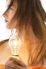 Woman with blue lips holding light bulb.jpg