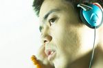 Youth listening to music on headphones.jpg